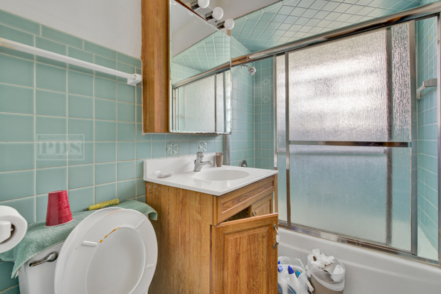 4346 Maple Avenue Brookfield, IL 60513 - Photo 15 of 18 a bathroom with a sink toilet and shower