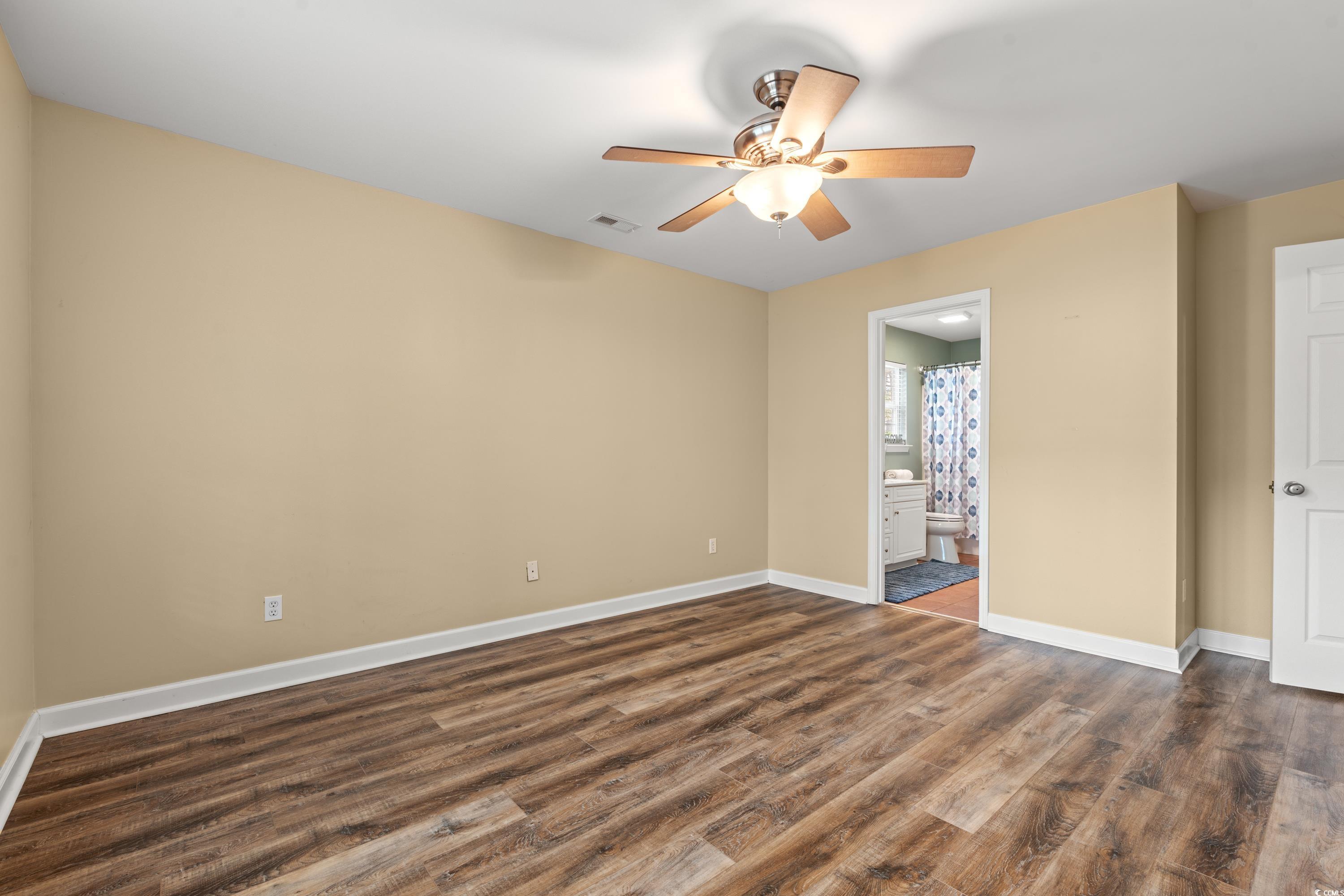 177 Reef Run Road Pawleys Island, SC 29585 - Photo 12 of 40 Unfurnished bedroom featuring baseboards, visible