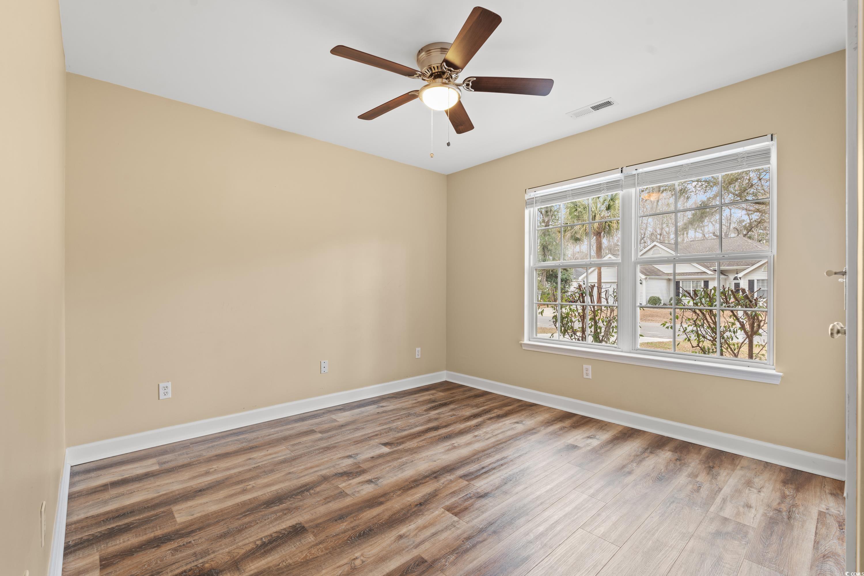 177 Reef Run Road Pawleys Island, SC 29585 - Photo 16 of 40 Spare room featuring a ceiling fan, visible vents,