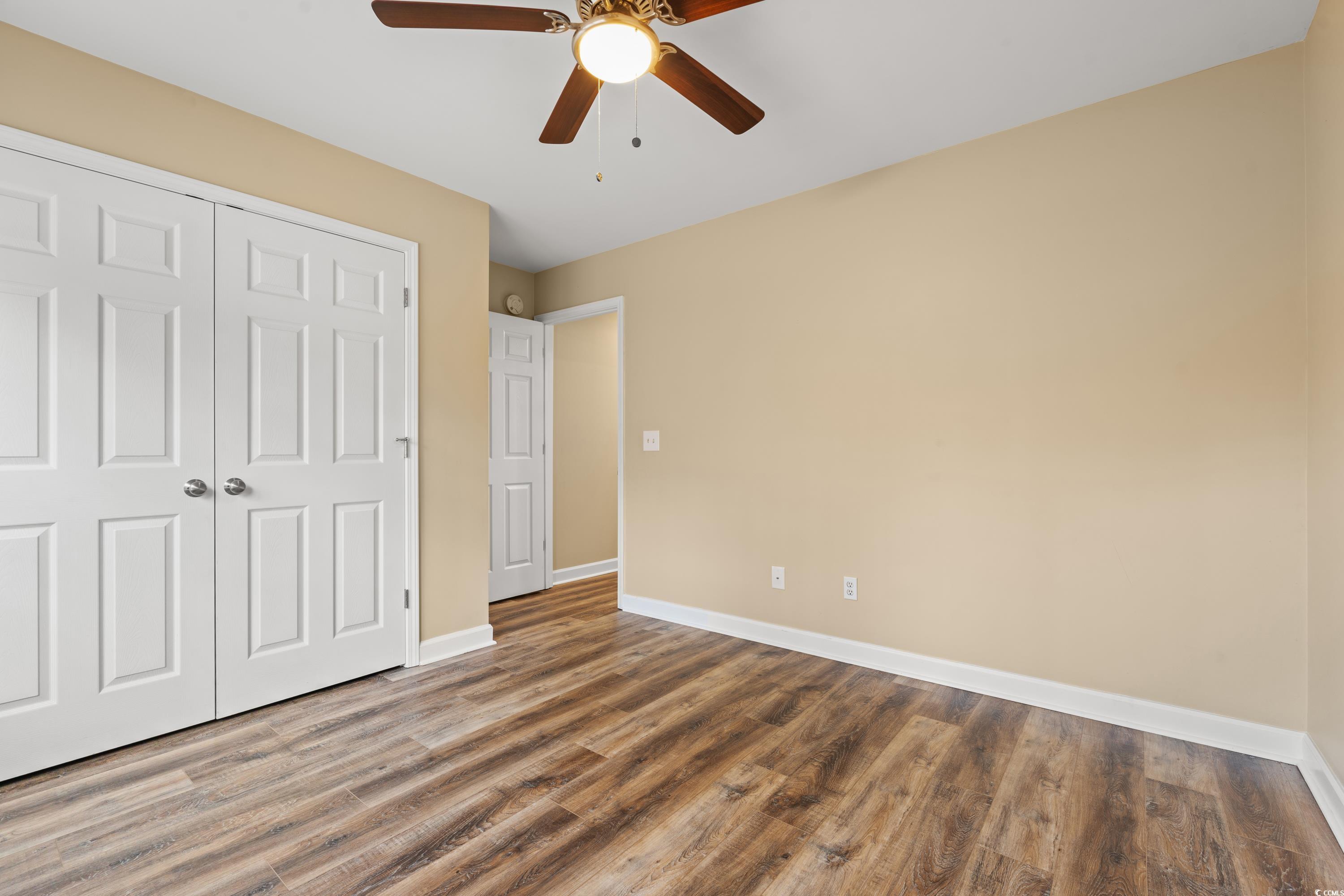 177 Reef Run Road Pawleys Island, SC 29585 - Photo 18 of 40 Unfurnished bedroom with a closet, ceiling fan, ba