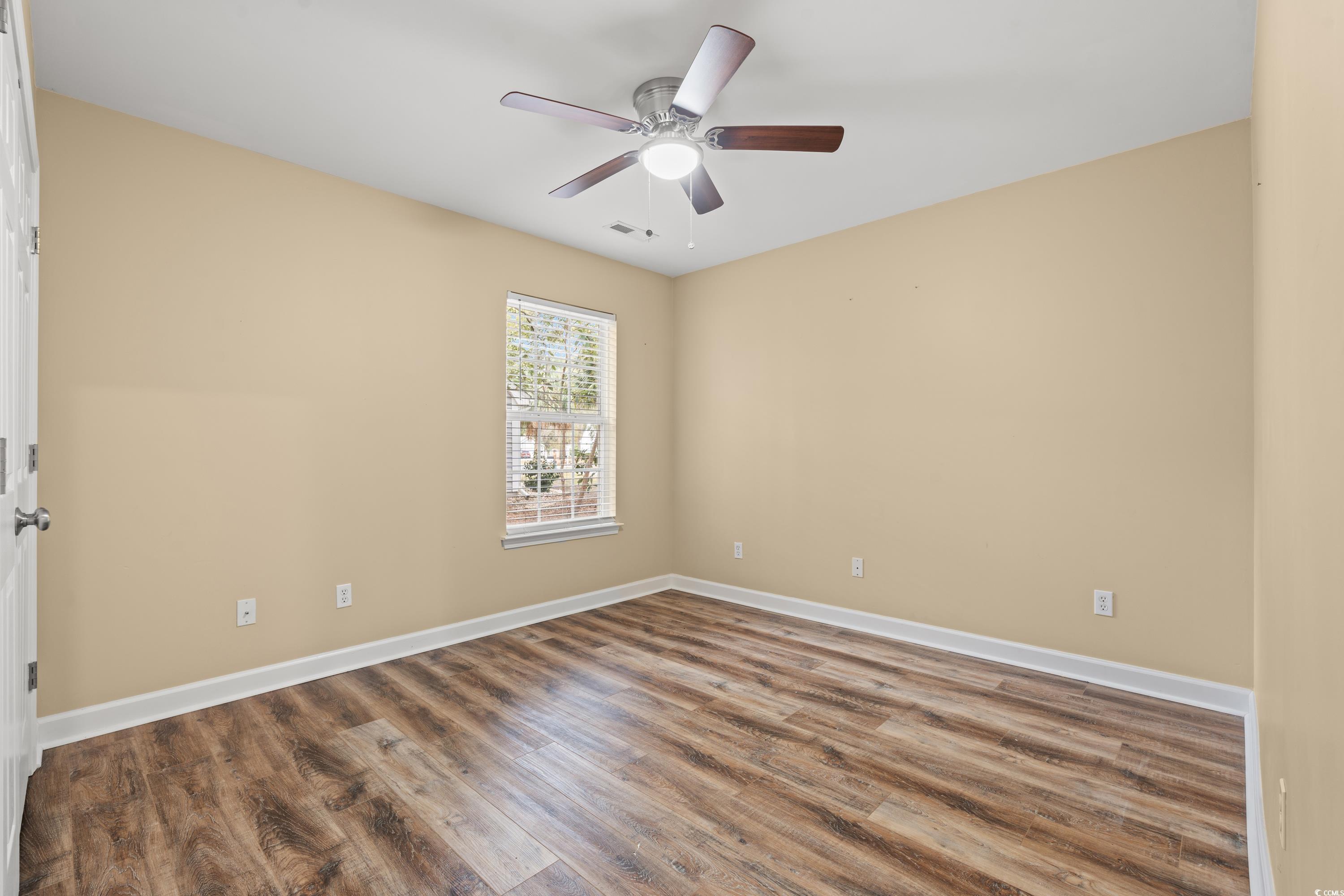 177 Reef Run Road Pawleys Island, SC 29585 - Photo 21 of 40 Spare room featuring ceiling fan, wood finished fl