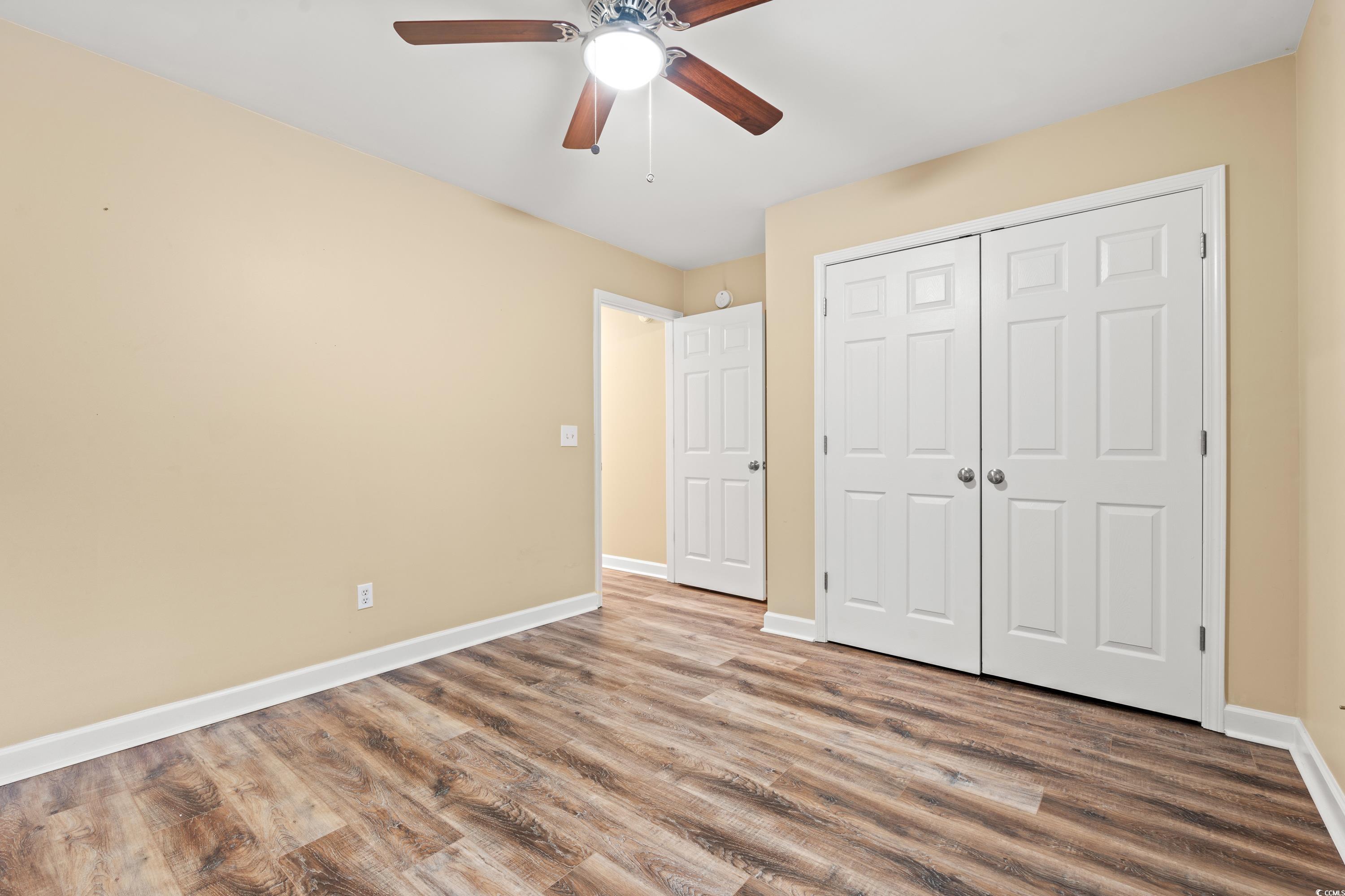 177 Reef Run Road Pawleys Island, SC 29585 - Photo 23 of 40 Unfurnished bedroom featuring a ceiling fan, a clo