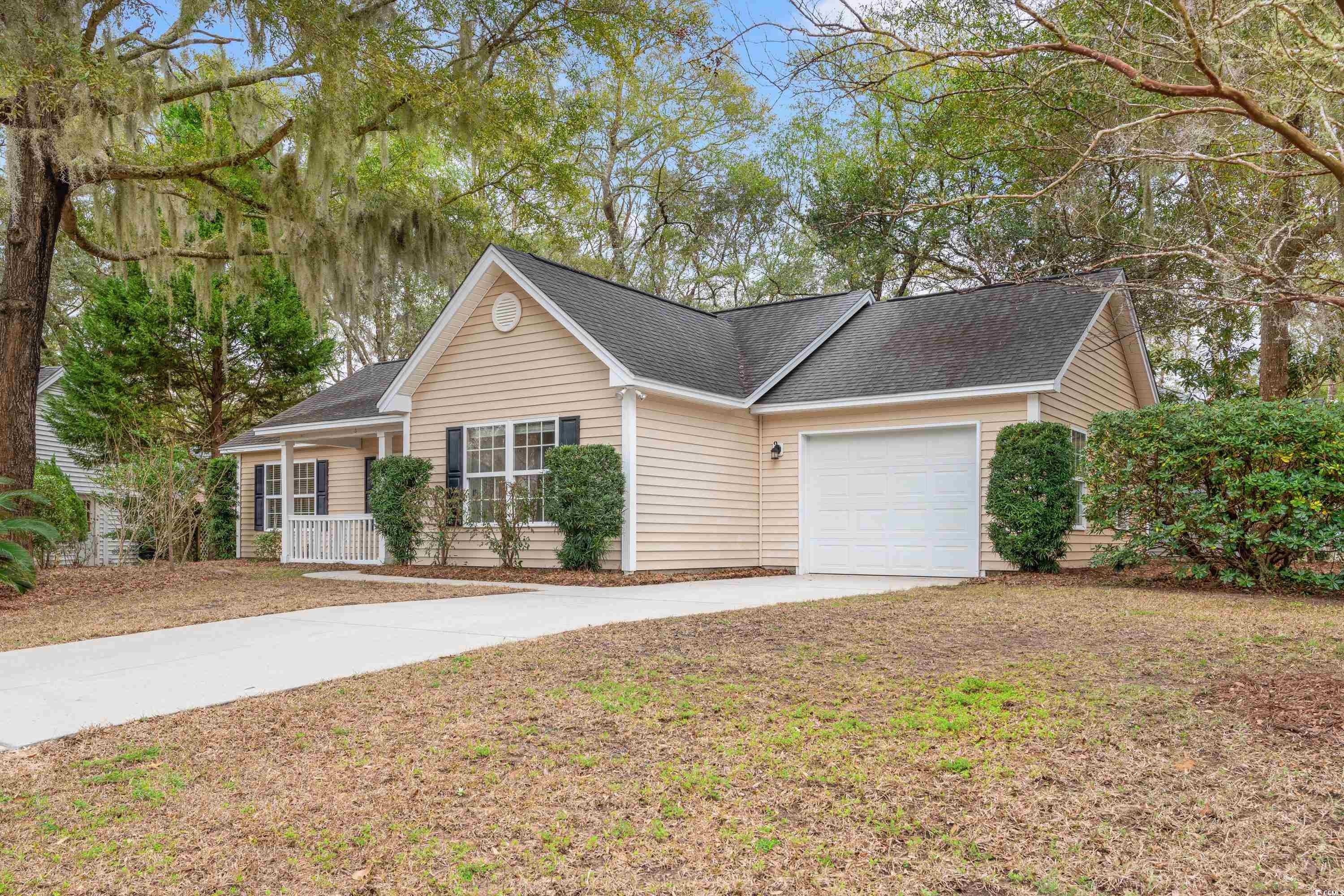 177 Reef Run Road Pawleys Island, SC 29585 - Photo 27 of 40 Single story home featuring driveway, a porch, roo