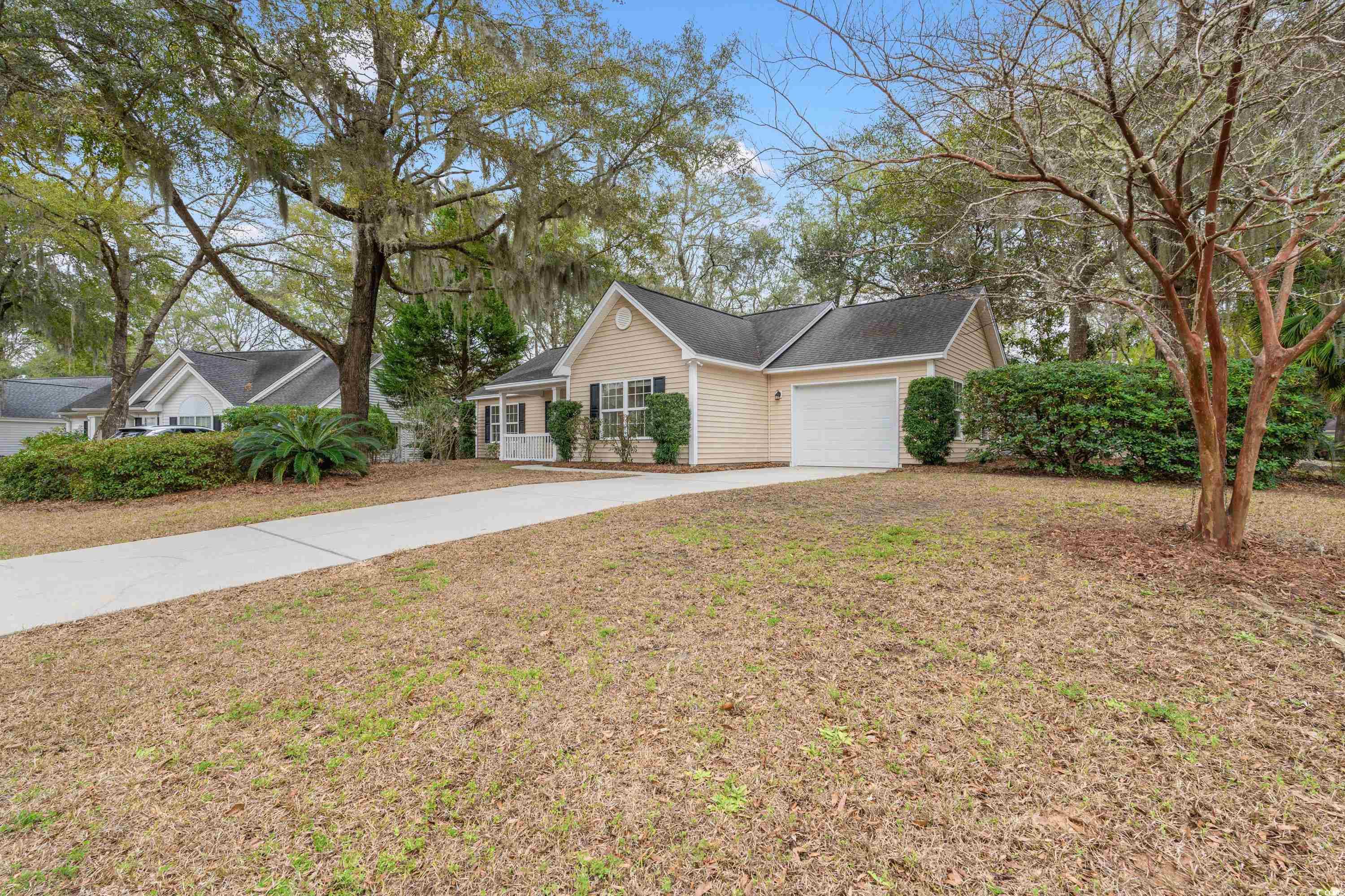 177 Reef Run Road Pawleys Island, SC 29585 - Photo 28 of 40 Ranch-style home featuring driveway, a garage, and