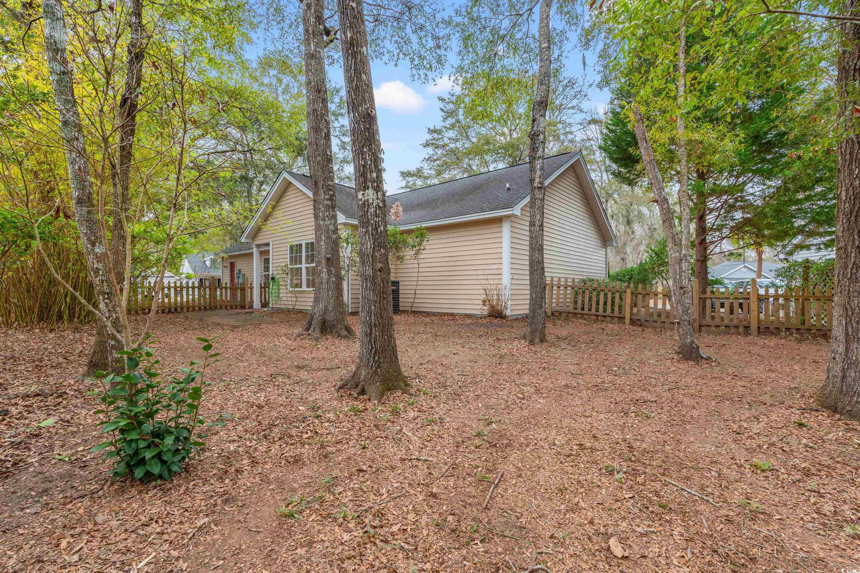 177 Reef Run Road Pawleys Island, SC 29585 - Photo 32 of 40 Rear view of house with fence