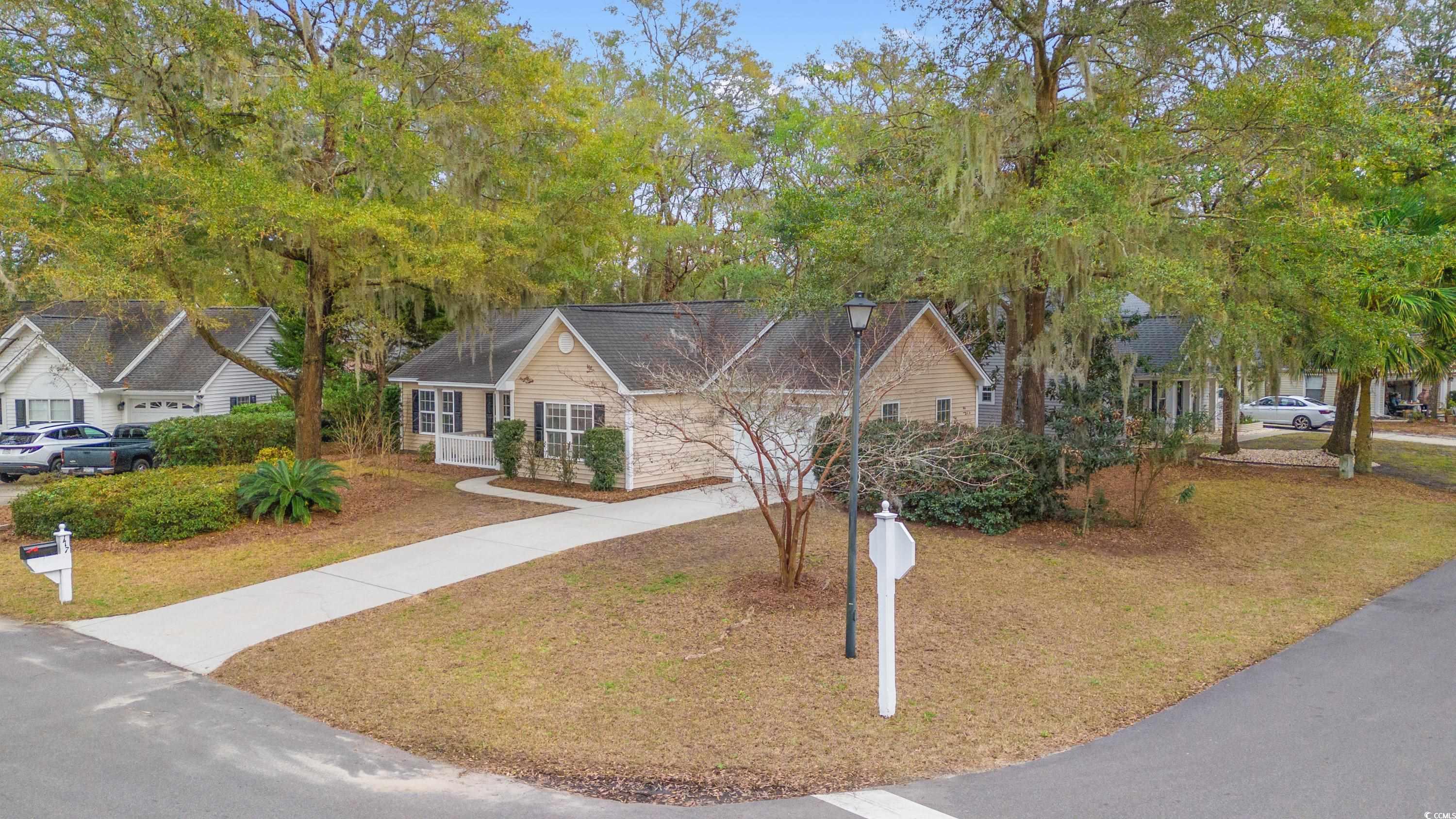 177 Reef Run Road Pawleys Island, SC 29585 - Photo 35 of 40 Ranch-style home with driveway and a front lawn