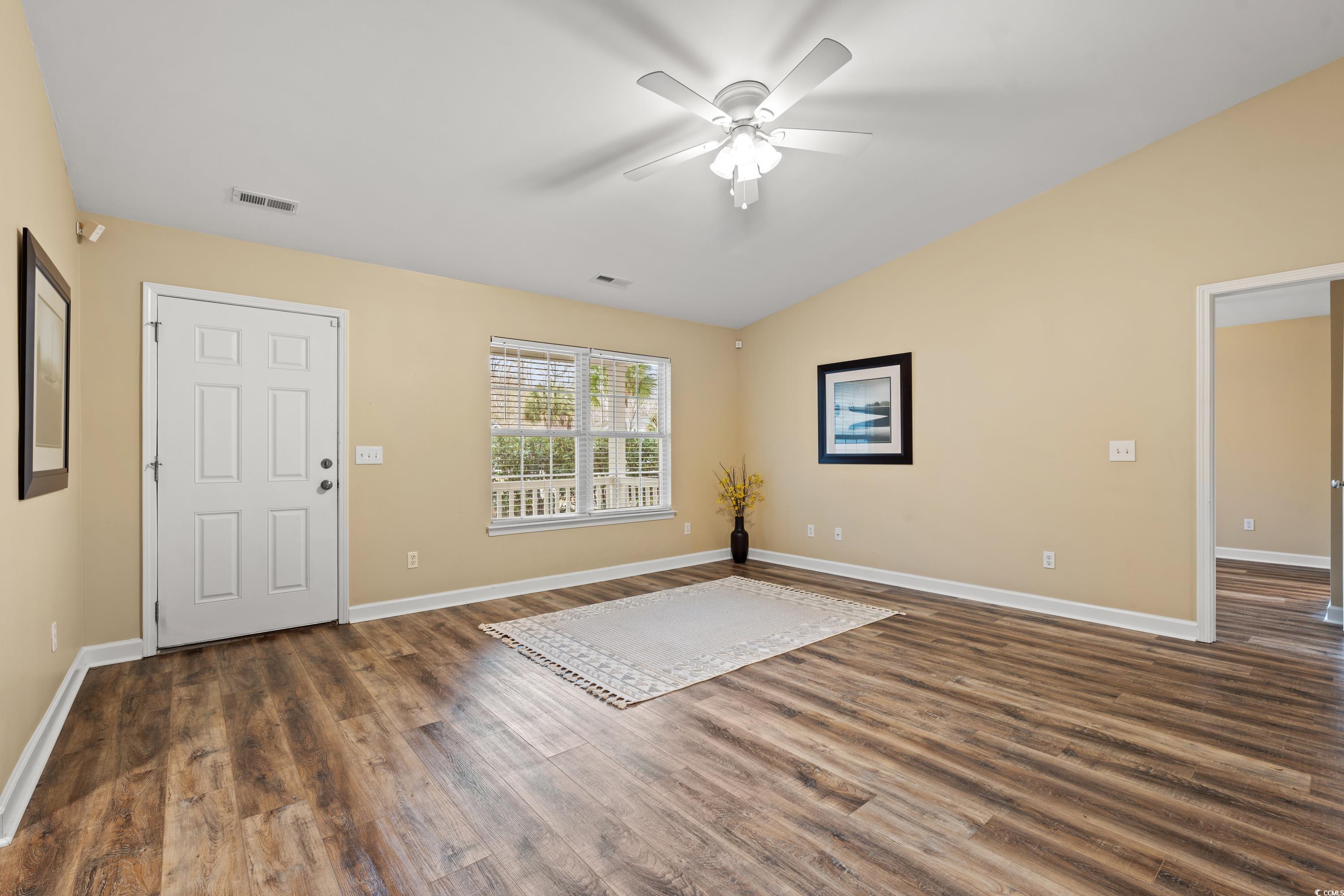 177 Reef Run Road Pawleys Island, SC 29585 - Photo 8 of 40 Interior space with dark wood-style flooring, a ce