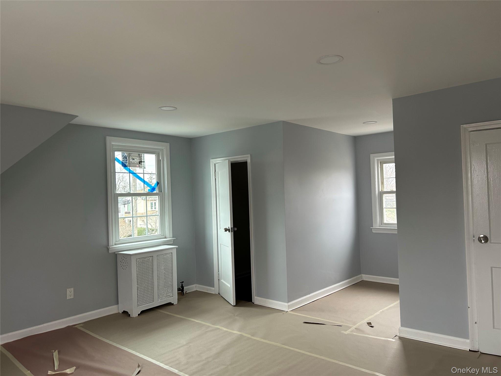 42 Princeton Street Valley Stream, NY 11580 - Photo 12 of 13 Unfurnished bedroom with radiator and carpet