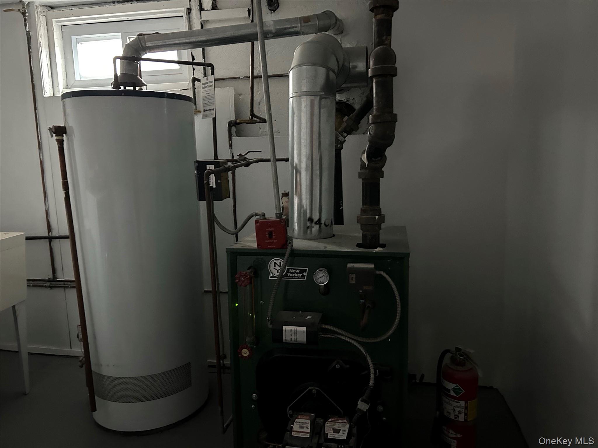 42 Princeton Street Valley Stream, NY 11580 - Photo 3 of 13 Utility room featuring water heater and a heating unit