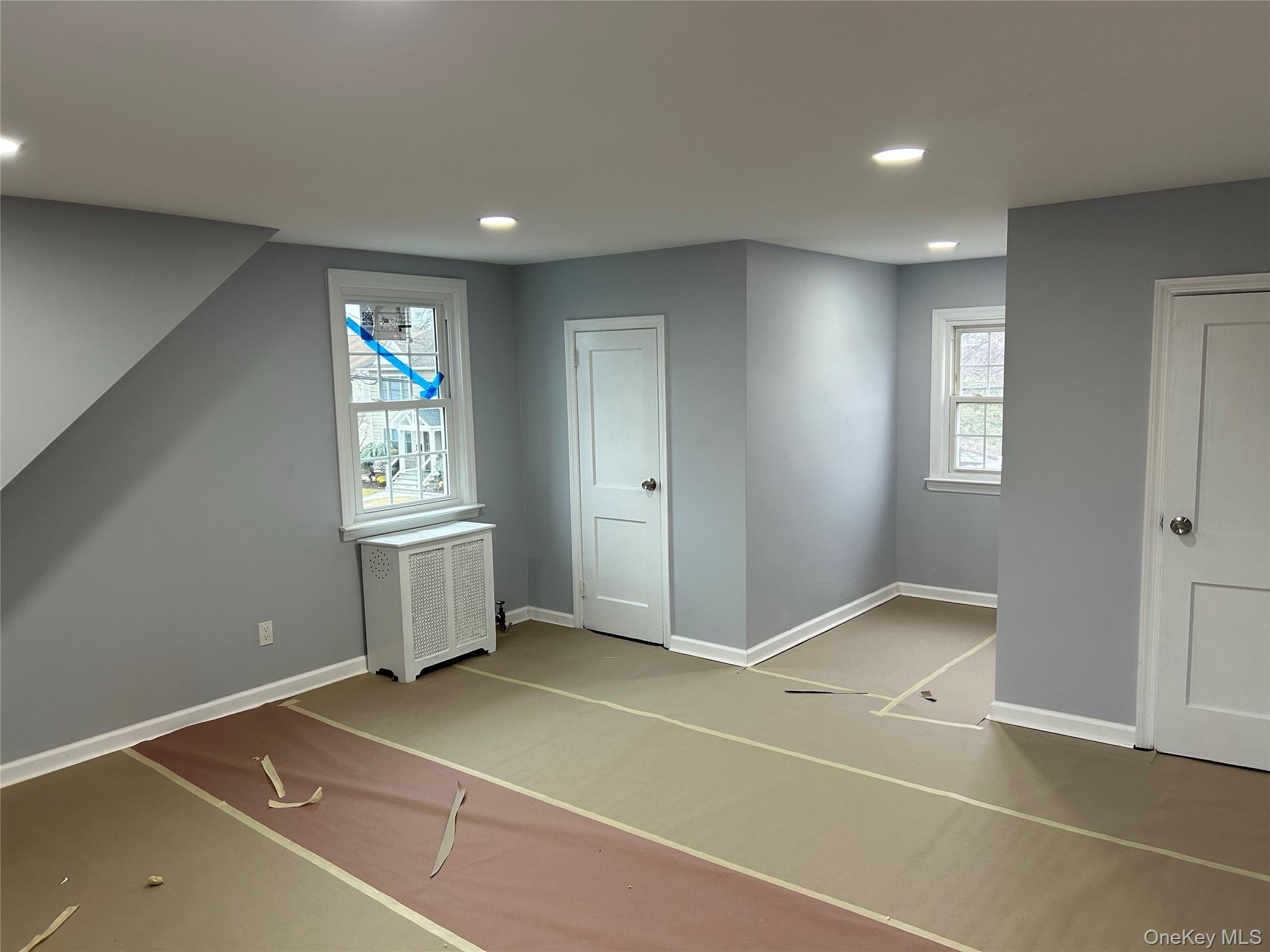 42 Princeton Street Valley Stream, NY 11580 - Photo 5 of 13 Bonus room with radiator heating unit, recessed lighting, and plenty of natural light