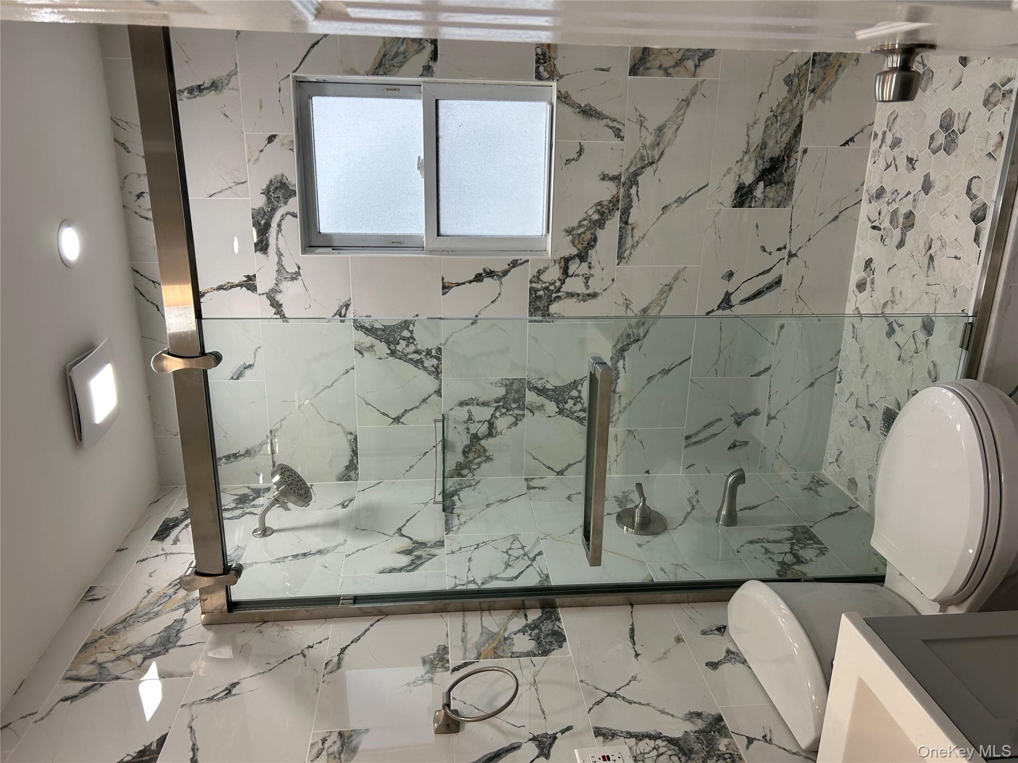 42 Princeton Street Valley Stream, NY 11580 - Photo 7 of 13 Bathroom featuring vanity and a marble finish shower