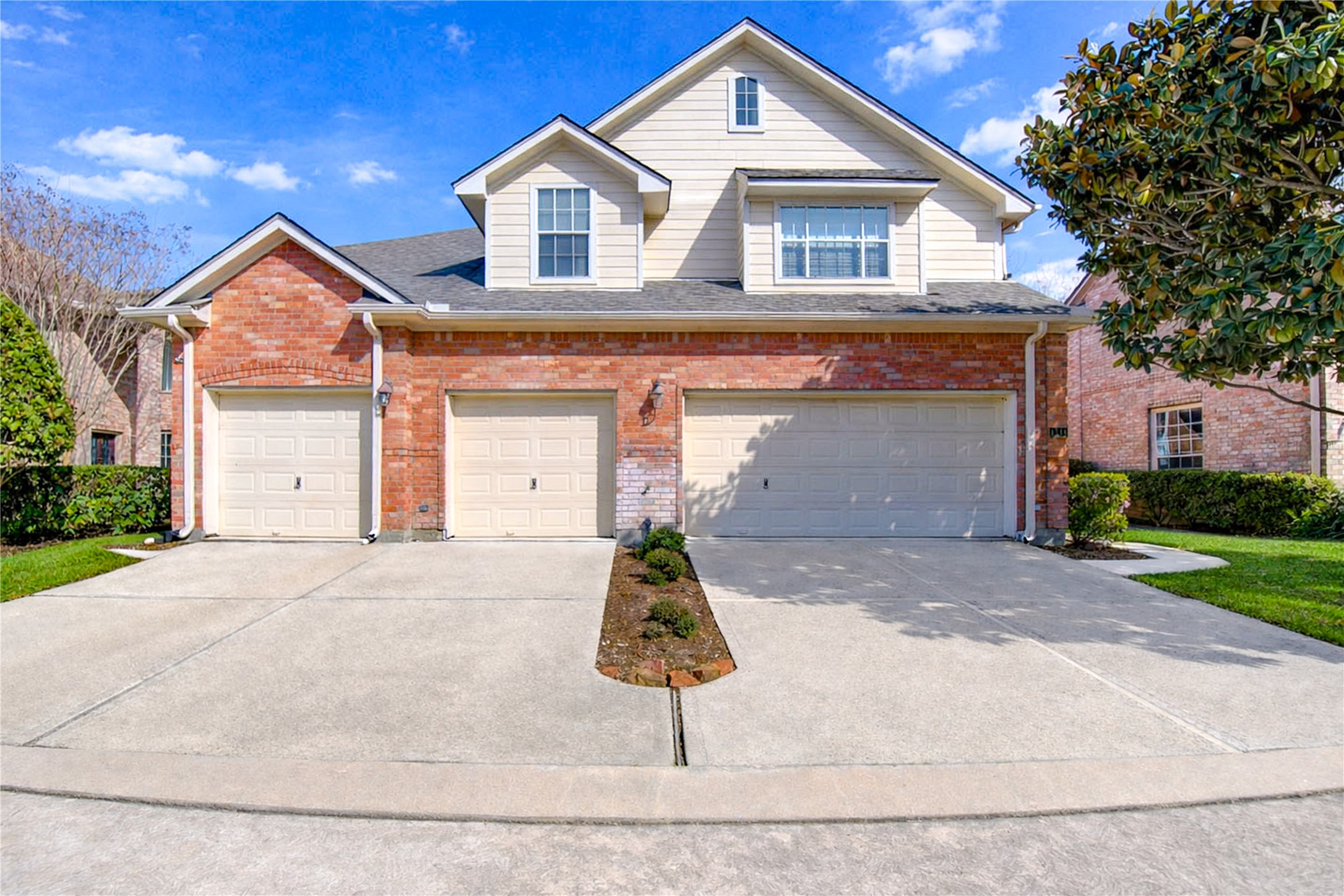 Charming townhome featuring a 2-car garage and attractive brick exterior. The home offers a clean, well-maintained façade with neutral tones and great curb appeal.

