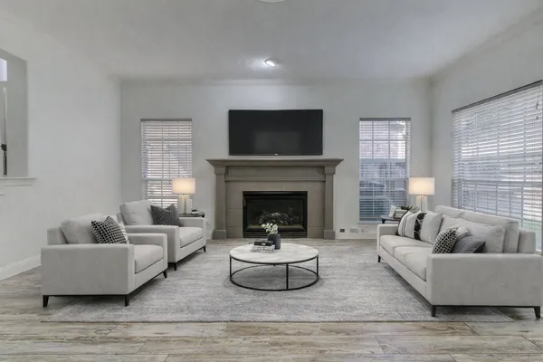 a living room with furniture and a fireplace