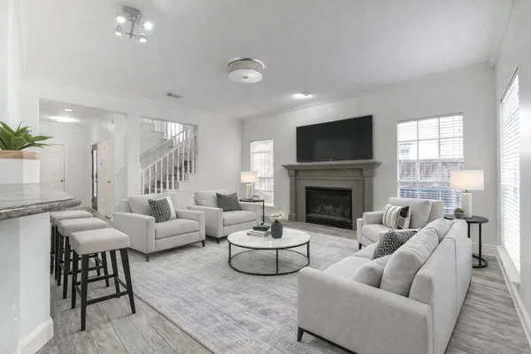 a living room with furniture and a fireplace