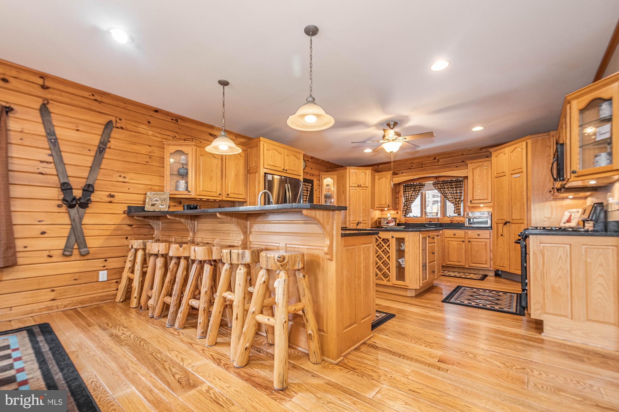 642 Deep Creek Highlands Road McHenry, MD 21541 - Photo 18 of 59 a view of a living room and kitchen view