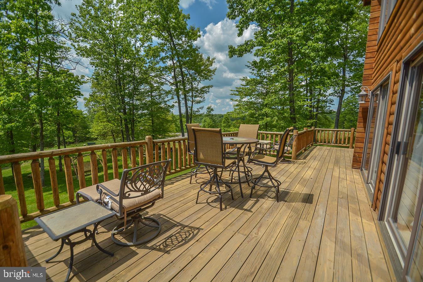 642 Deep Creek Highlands Road McHenry, MD 21541 - Photo 4 of 59 a view of a chairs and table on the wooden floor