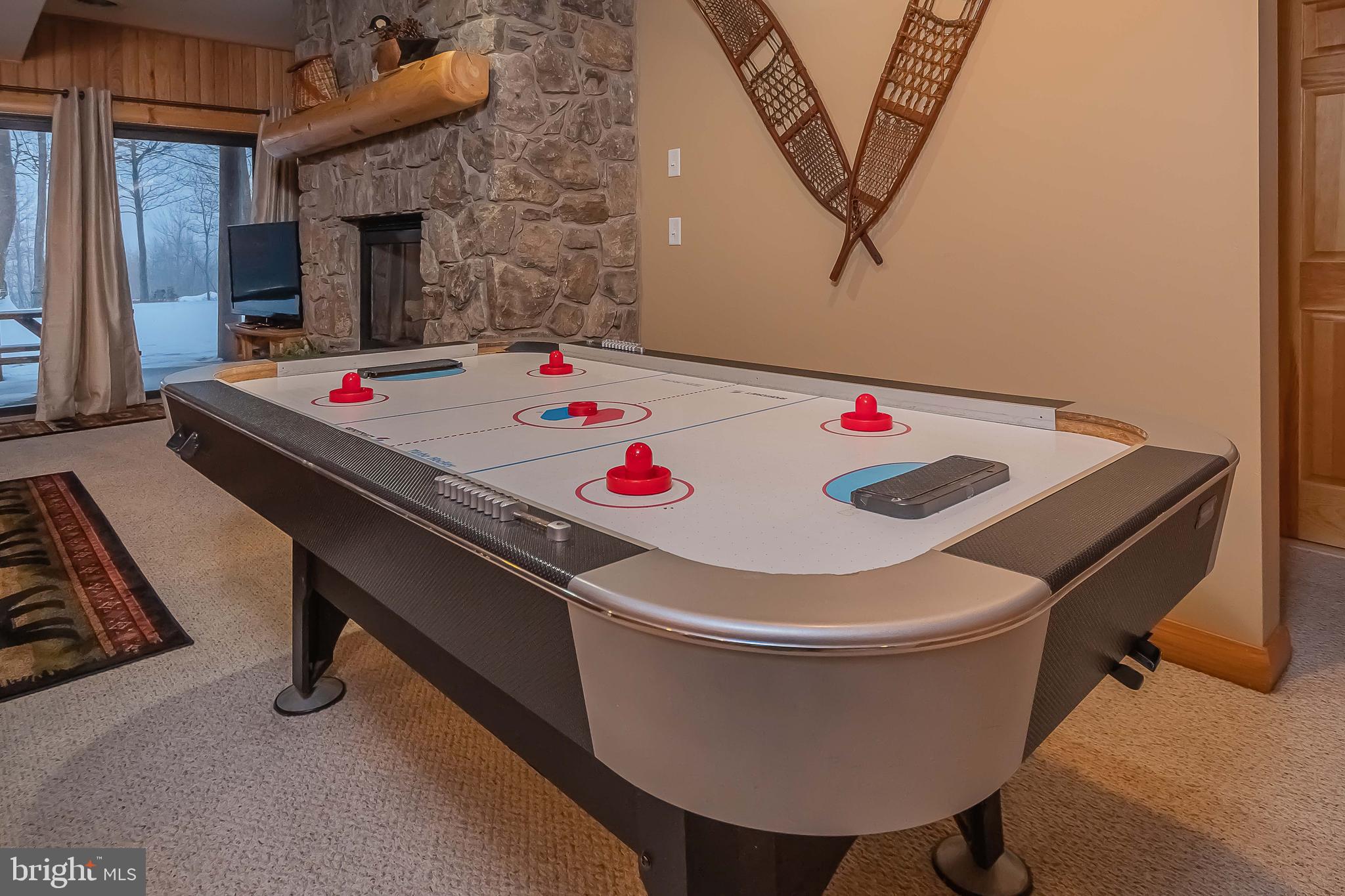 642 Deep Creek Highlands Road McHenry, MD 21541 - Photo 52 of 59 a dinning table sitting next to a white stove top oven and a sink