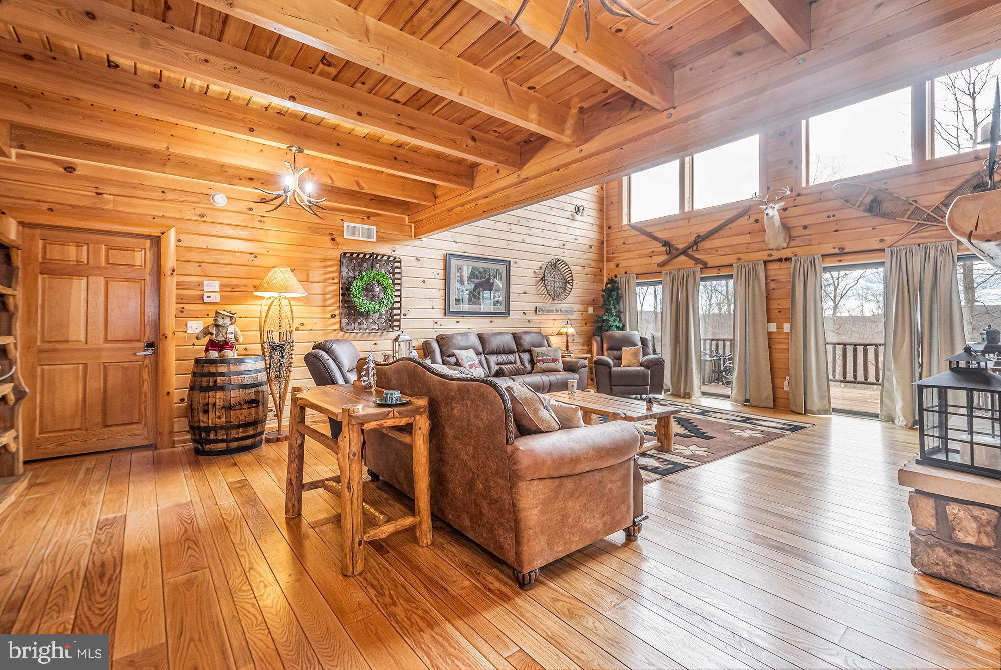 642 Deep Creek Highlands Road McHenry, MD 21541 - Photo 7 of 59 a living room with furniture and wooden floor