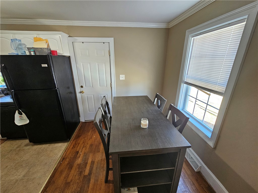 237 Pine Lane Anderson, SC 29621 - Photo 15 of 23 This cozy kitchen area features rich hardwood flooring and bright natural light.