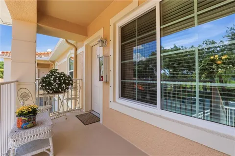 a view of a house with a potted plant