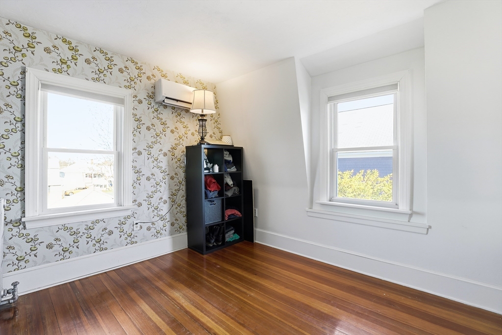 23 A Street Hull, MA 02045 - Photo 19 of 42 an empty room with windows and closet