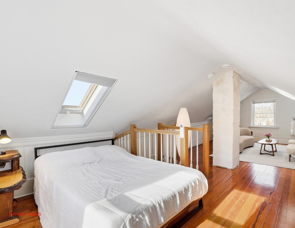 23 A Street Hull, MA 02045 - Photo 24 of 42 a bedroom with a bed and a large window