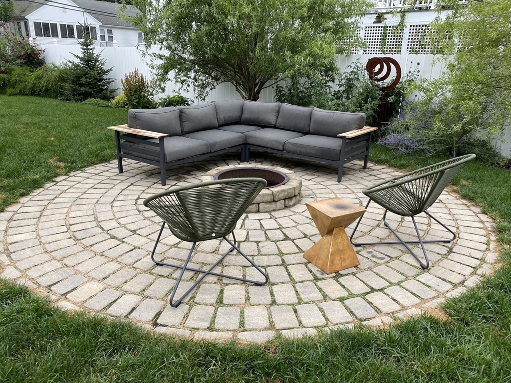 23 A Street Hull, MA 02045 - Photo 32 of 42 a view of a chairs and table in backyard