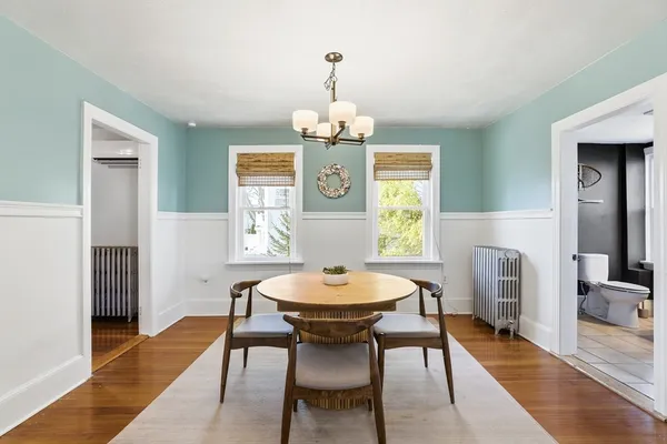 a view of a dining room with furniture and wooden floor