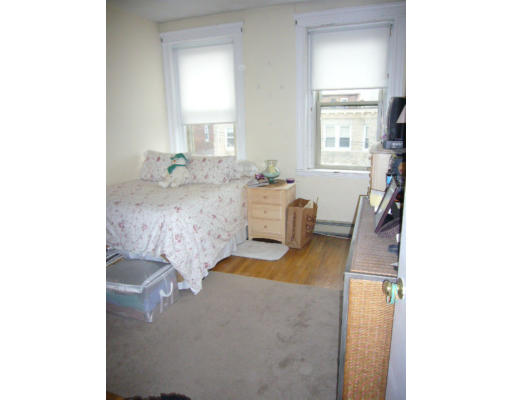 9 Colborne Road, Unit 18 Boston, MA 02135 - Photo 3 of 7 a living room with furniture and a window