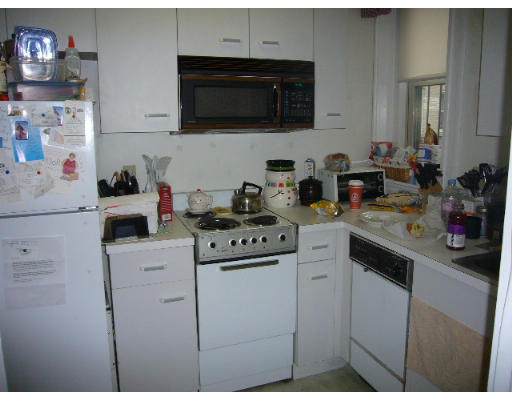 9 Colborne Road, Unit 18 Boston, MA 02135 - Photo 4 of 7 a kitchen with a sink dishwasher stove and white cabinets