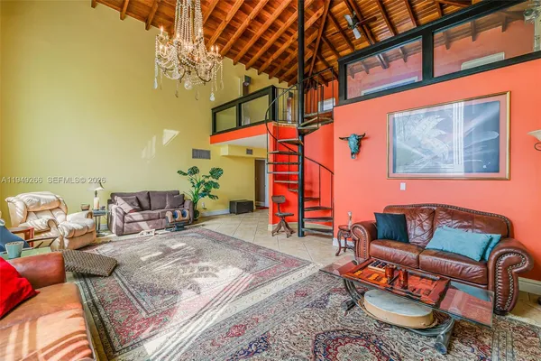 a living room with furniture and a rug