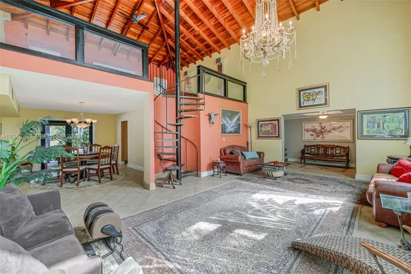 a kitchen with stainless steel appliances granite countertop a sink and a stove