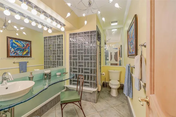 a bedroom with a bed couch and window