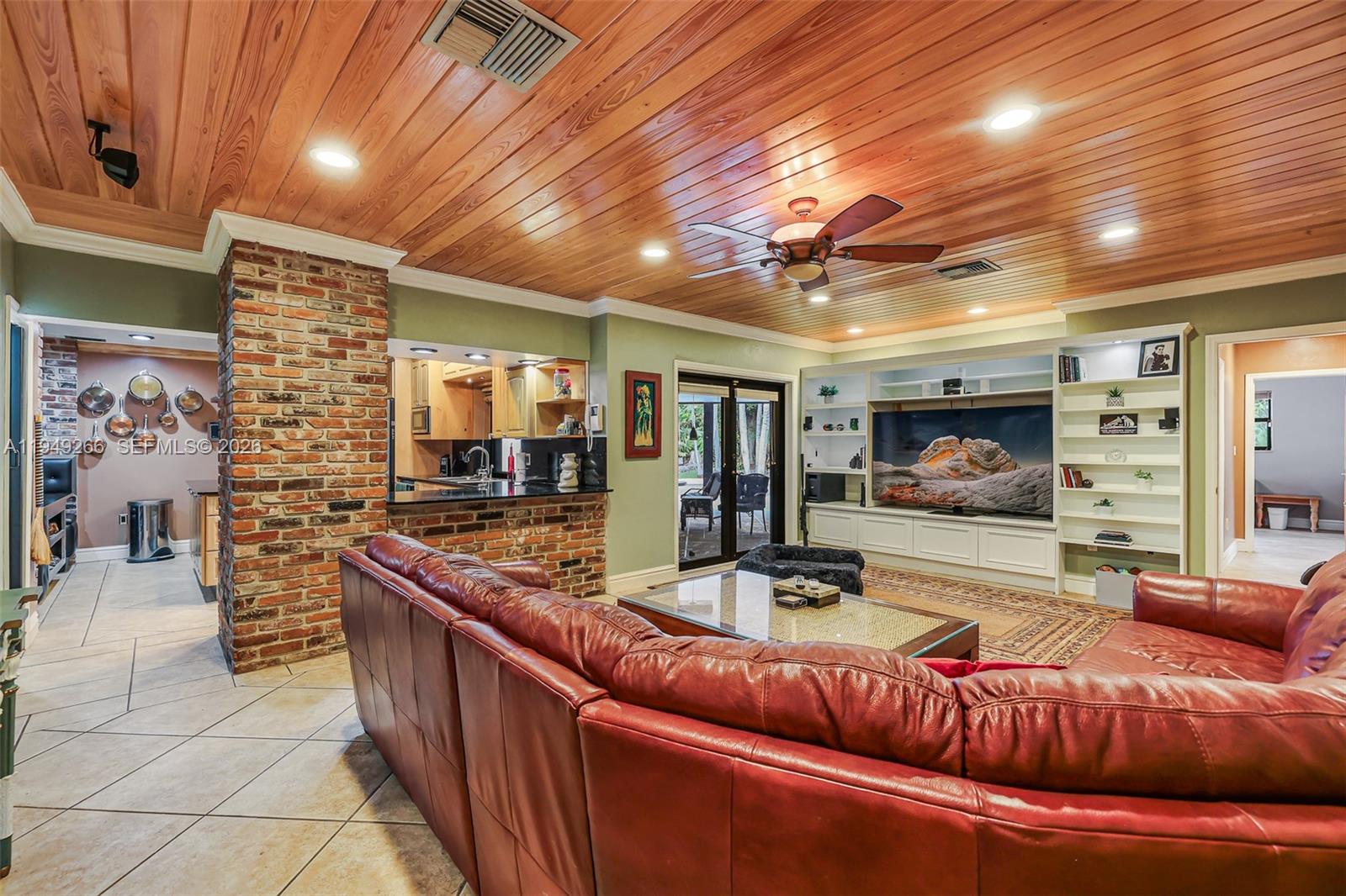 18975 Southwest 224th Street Miami, FL 33170 - Photo 25 of 97 a living room with furniture and a flat screen tv