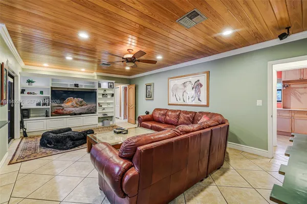 a bedroom with a bed and a dresser in it