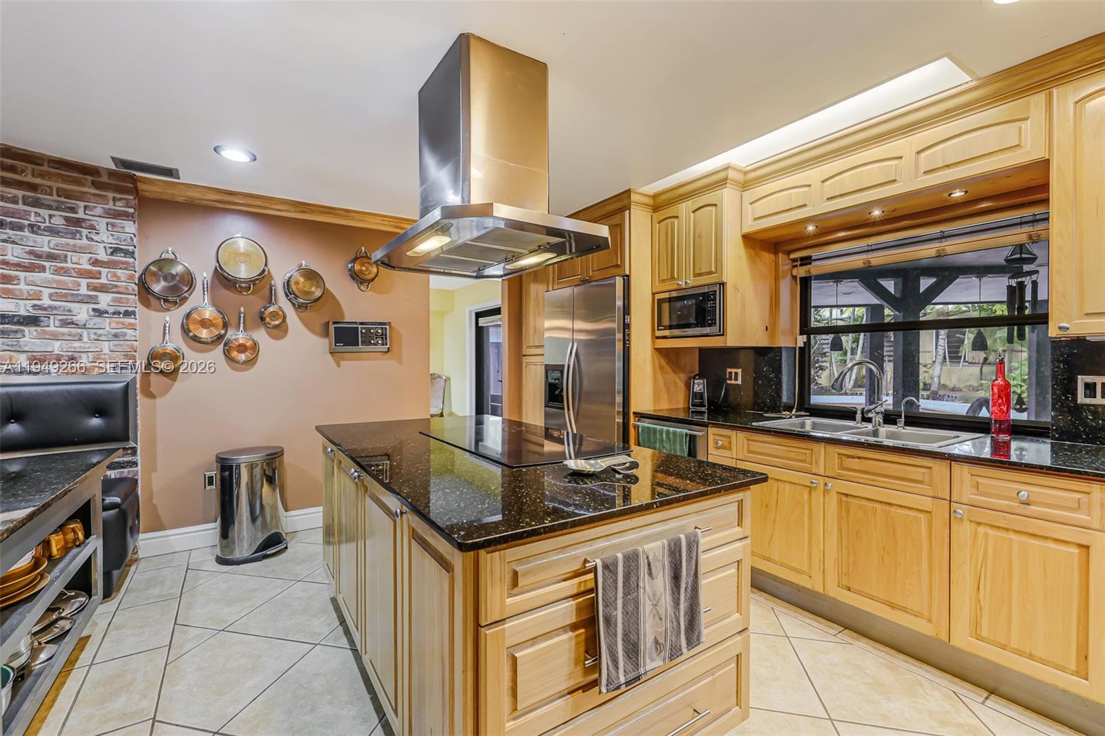 18975 Southwest 224th Street Miami, FL 33170 - Photo 29 of 97 a kitchen with stainless steel appliances granite countertop a sink and a stove