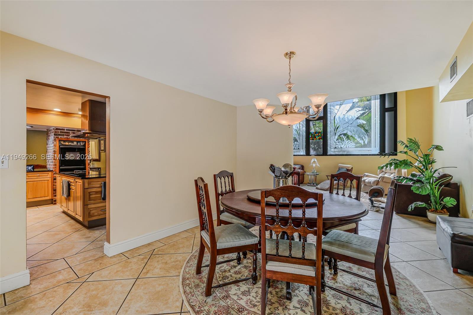 18975 Southwest 224th Street Miami, FL 33170 - Photo 35 of 97 a view of a dining room with furniture and chandelier