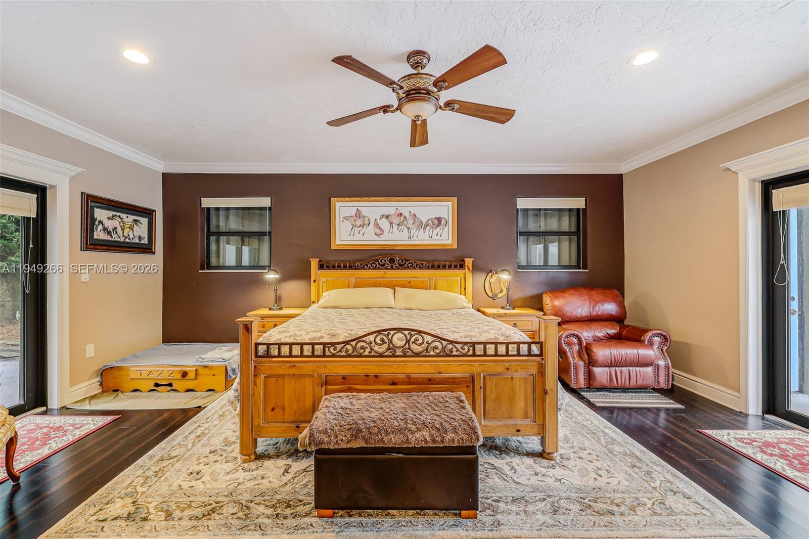 18975 Southwest 224th Street Miami, FL 33170 - Photo 40 of 97 a bedroom with a bed and wooden floor