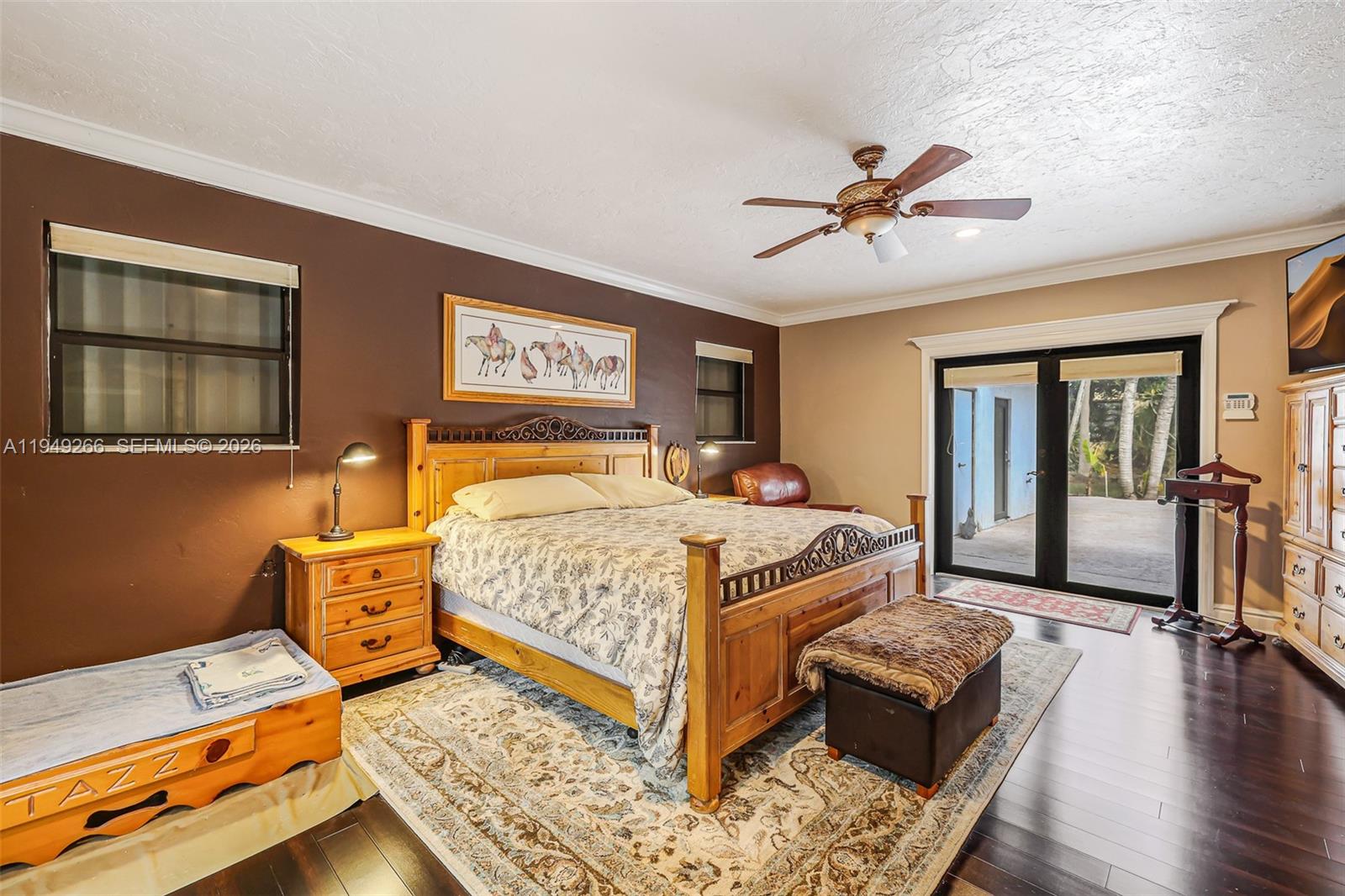 18975 Southwest 224th Street Miami, FL 33170 - Photo 42 of 97 a bedroom with a bed and wooden floor