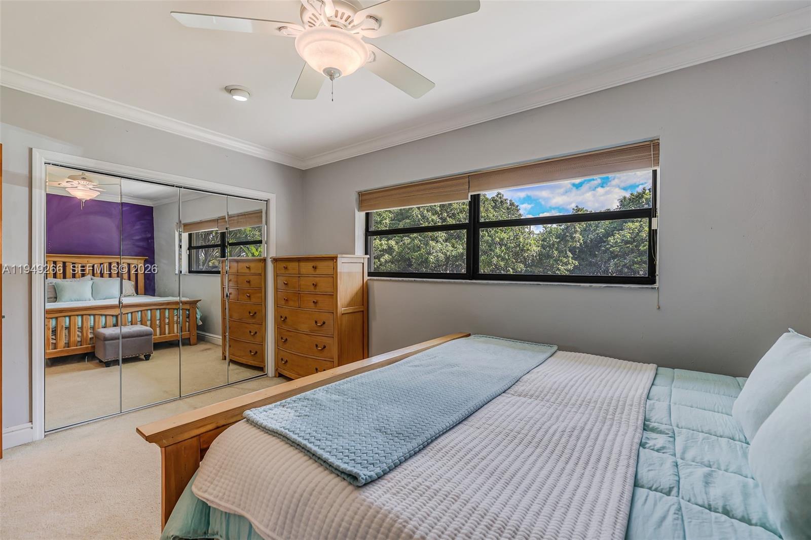 18975 Southwest 224th Street Miami, FL 33170 - Photo 45 of 97 a bedroom with a large bed and a window