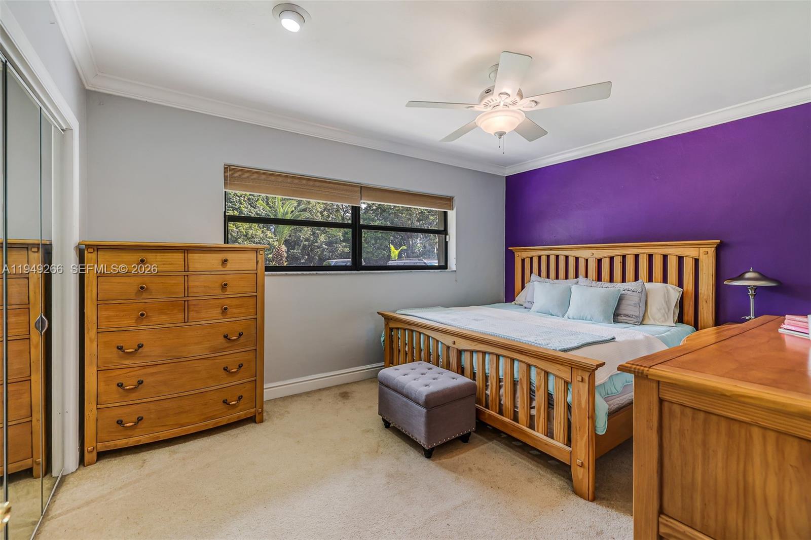 18975 Southwest 224th Street Miami, FL 33170 - Photo 47 of 97 a bedroom with a bed and a chandelier