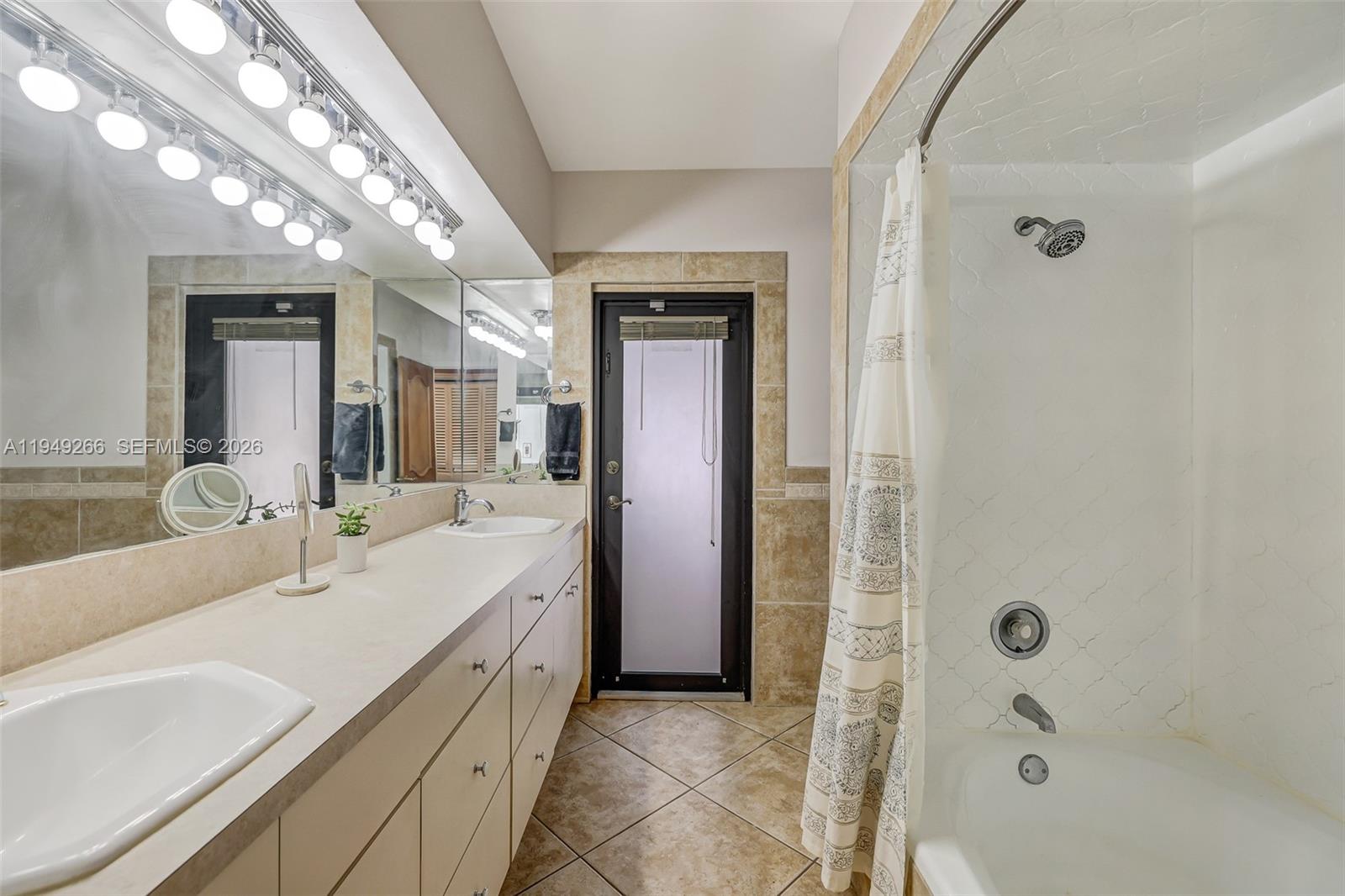 18975 Southwest 224th Street Miami, FL 33170 - Photo 48 of 97 a spacious bathroom with a double vanity sink a mirror and shower