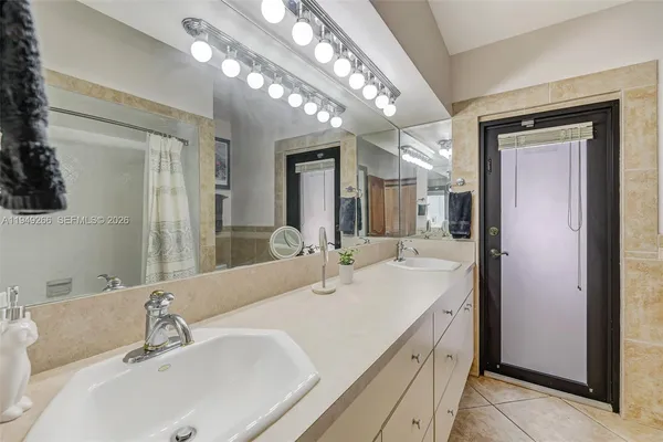 an aerial view of a residential houses with outdoor space and street view