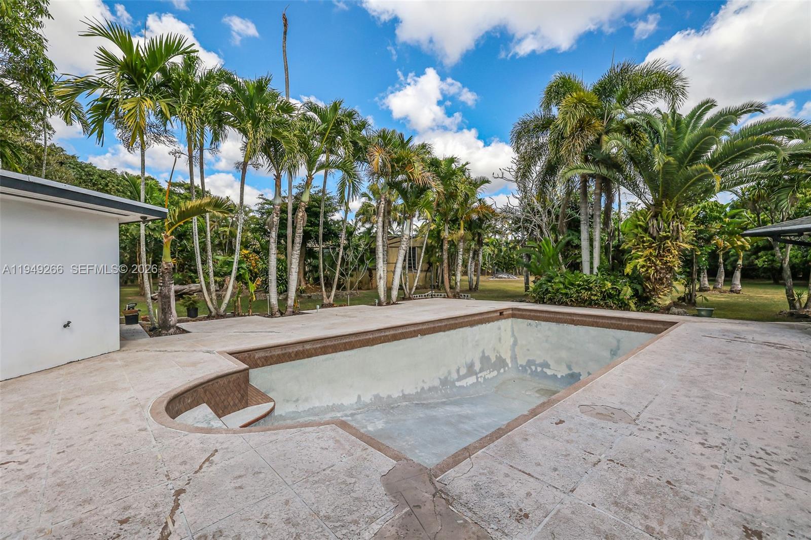 18975 Southwest 224th Street Miami, FL 33170 - Photo 59 of 97 a view of a backyard with palm trees