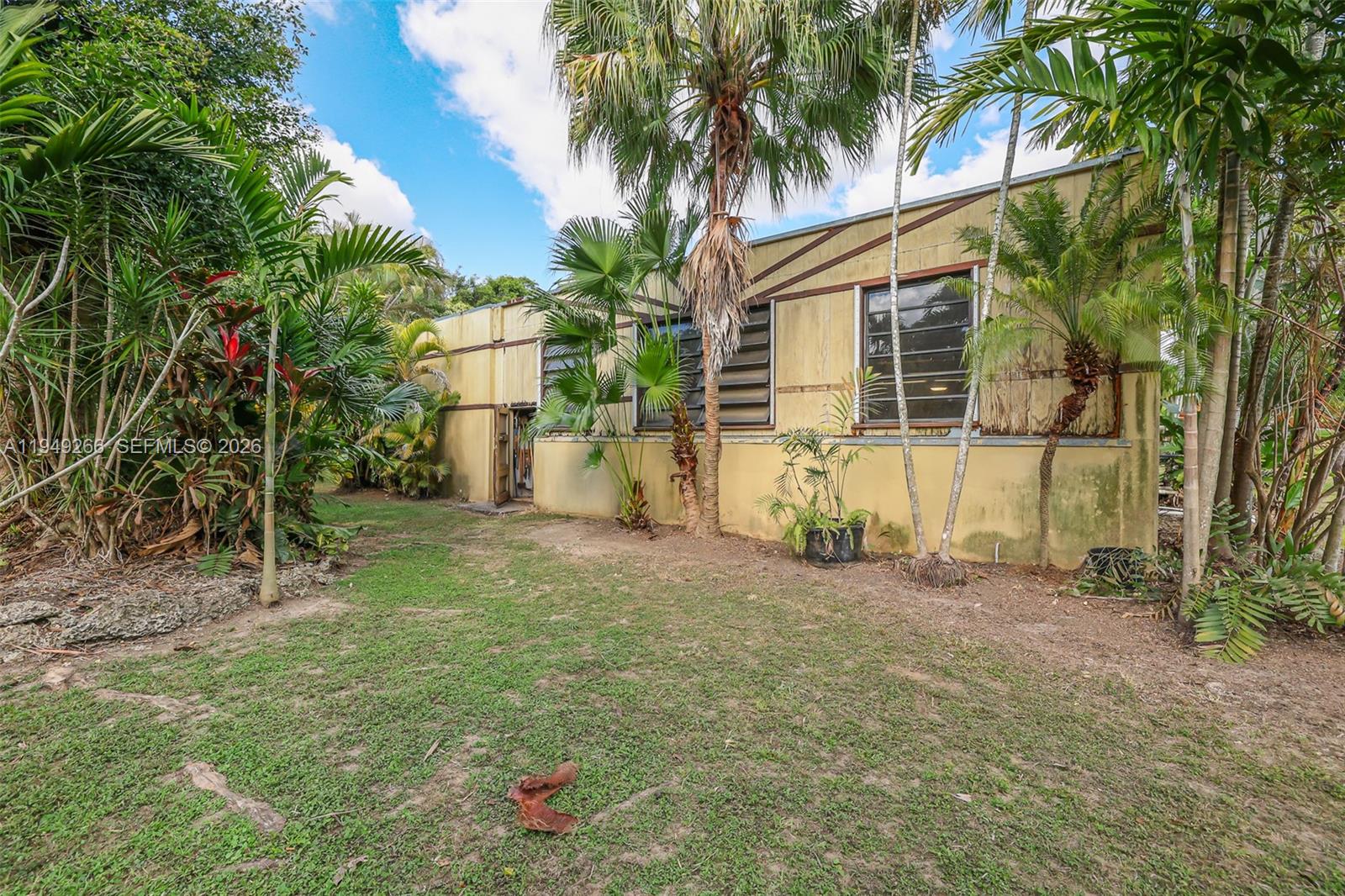 18975 Southwest 224th Street Miami, FL 33170 - Photo 66 of 97 a view of a backyard with a tree