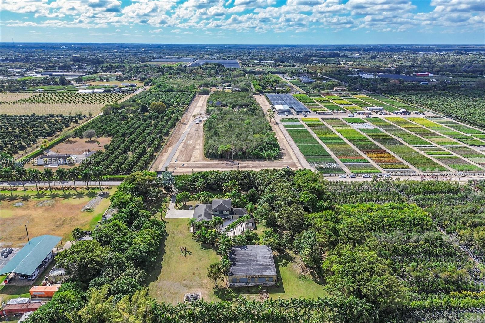 18975 Southwest 224th Street Miami, FL 33170 - Photo 92 of 97 an aerial view of residential houses with outdoor space and ocean view