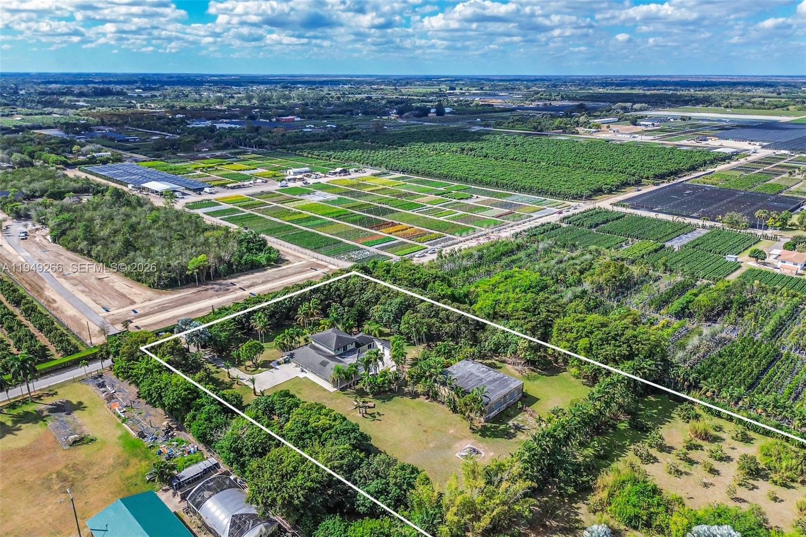 18975 Southwest 224th Street Miami, FL 33170 - Photo 93 of 97 a view of a yard with wooden floor