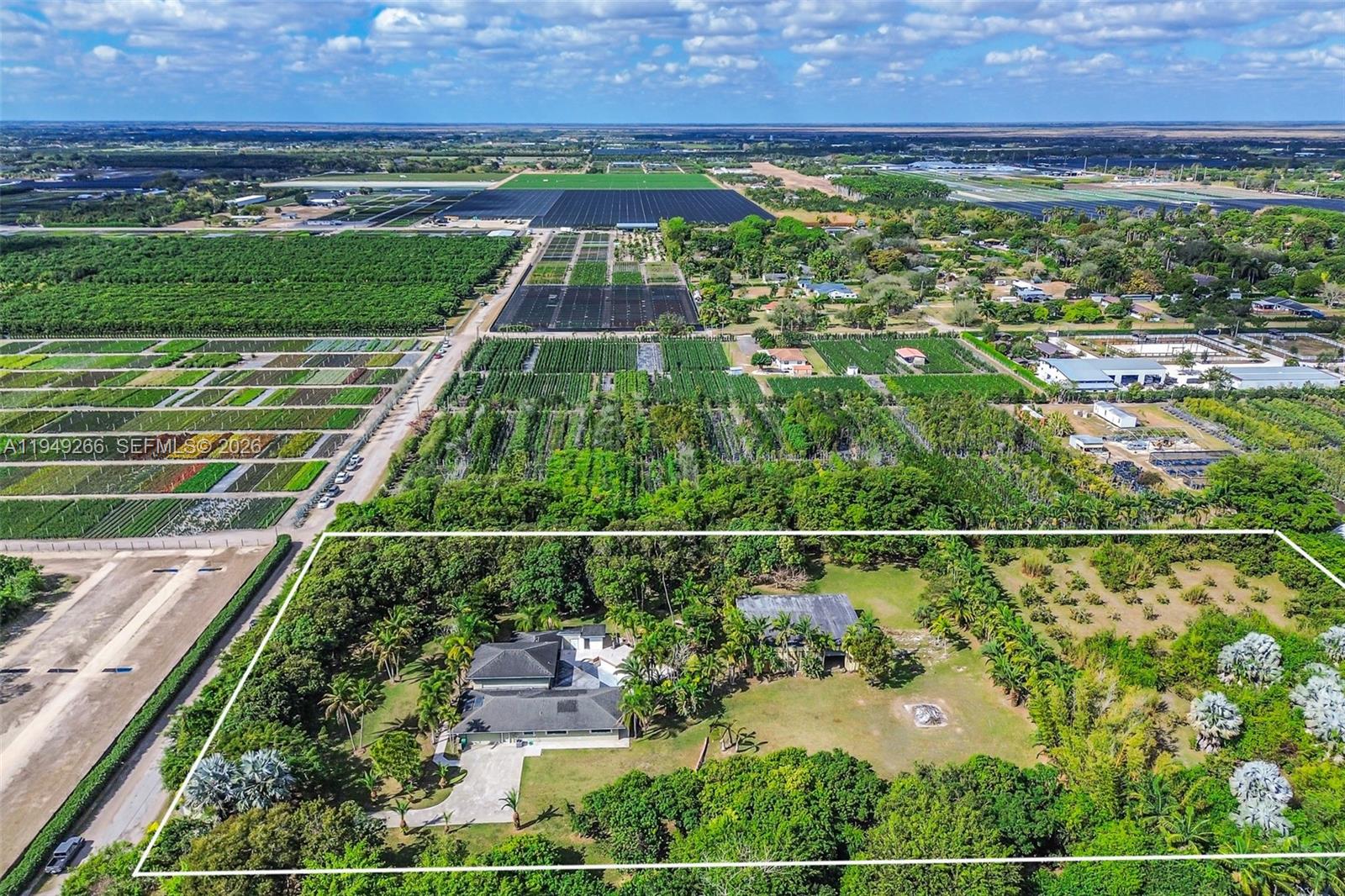 18975 Southwest 224th Street Miami, FL 33170 - Photo 94 of 97 an aerial view of a residential houses with outdoor space and street view