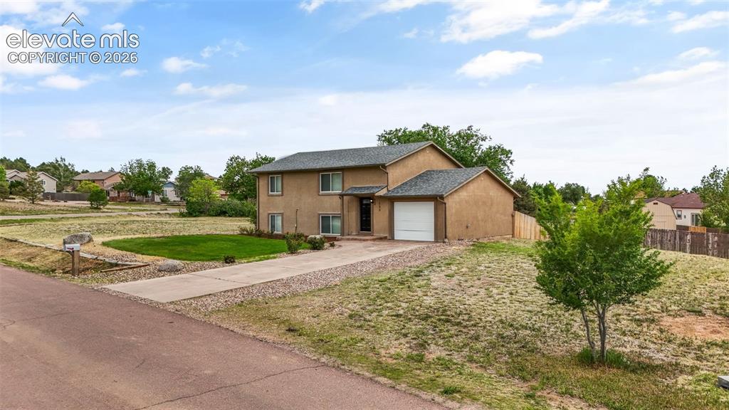 125 Diamond E Road Fountain, CO 80817 - Photo 4 of 43 a house view with a garden space