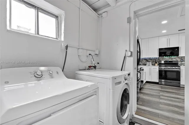 a utility room with dryer and washer